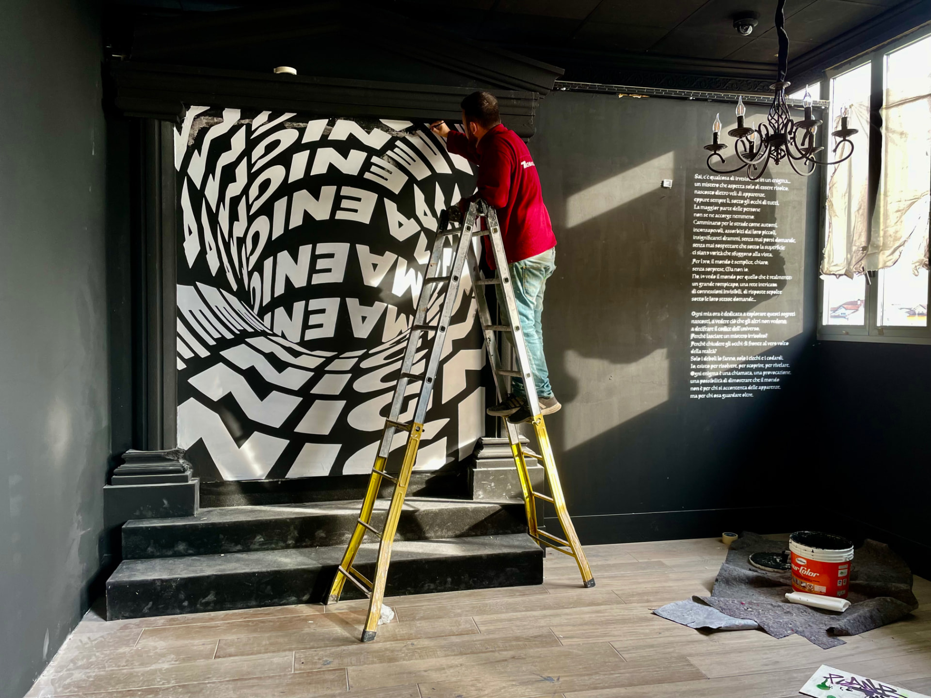 Black and white optical mural painted inside a stairwell